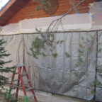 tarped east wall